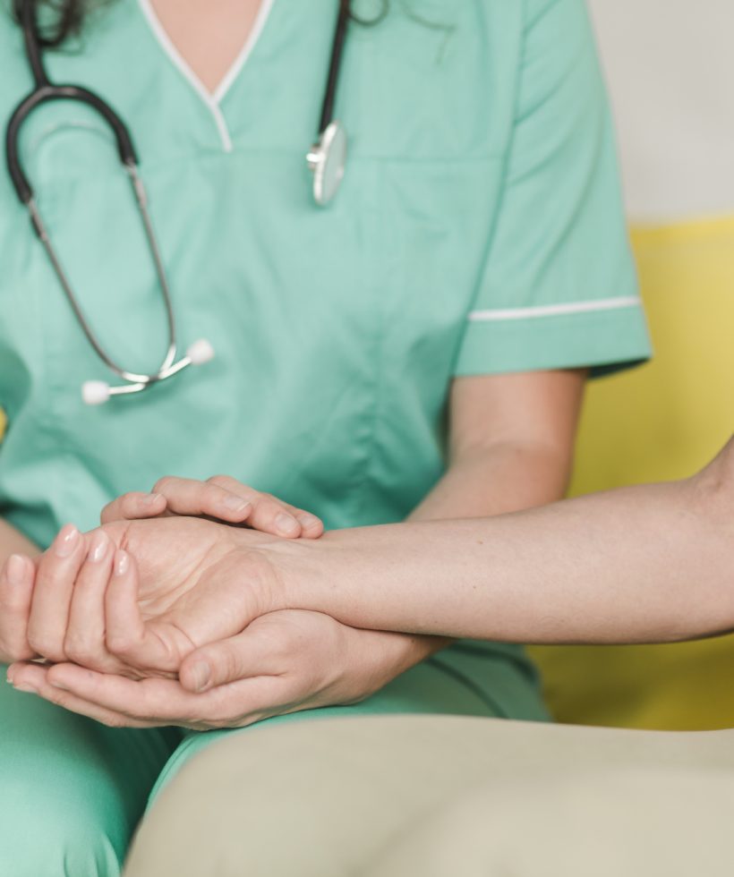 nurse-checking-pulse-on-female-patient-s-wrist